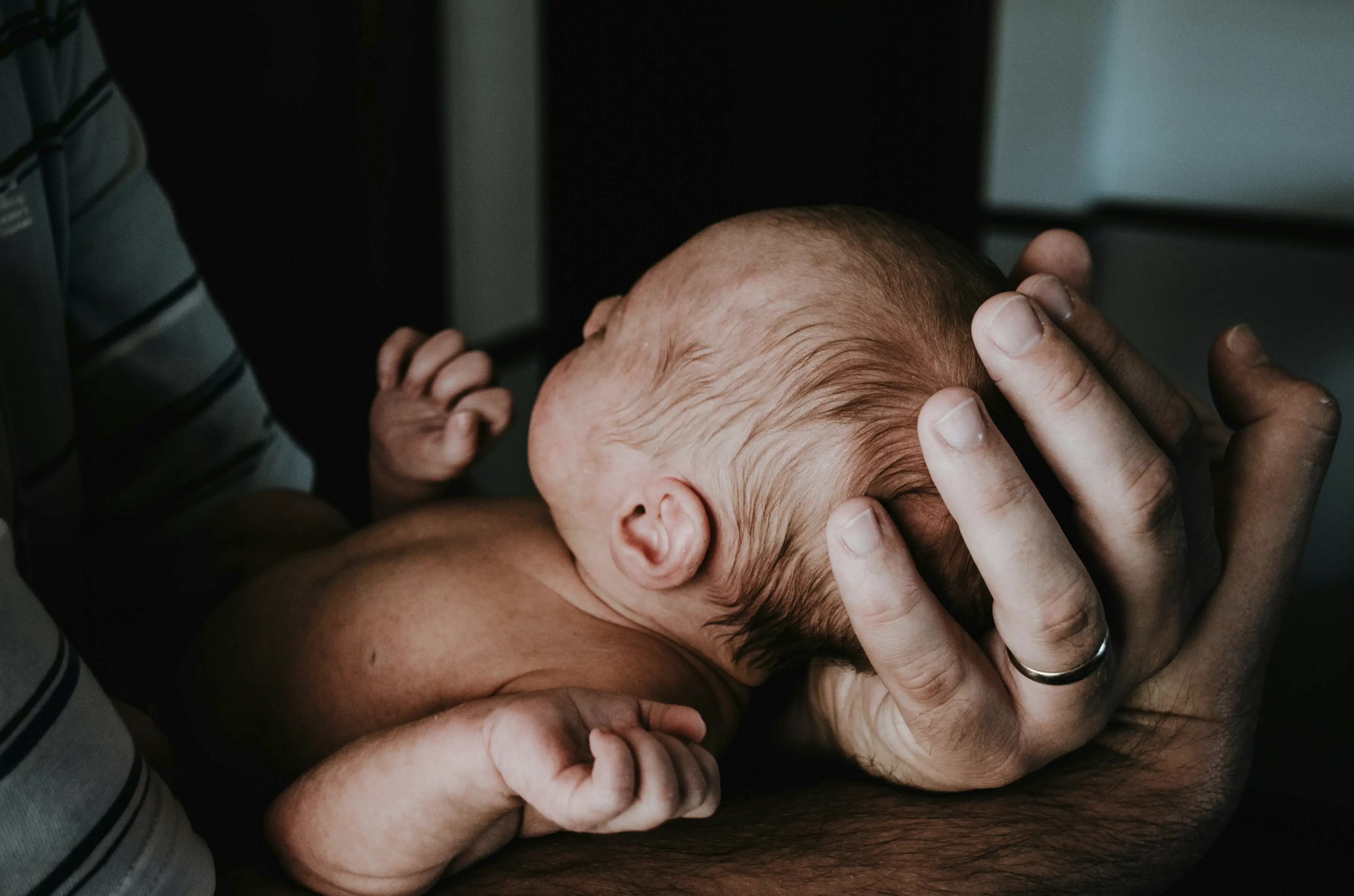 Holding a baby firmly